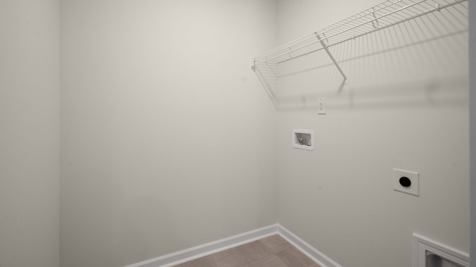 Laundry room with vinyl flooring