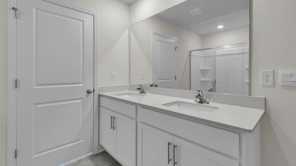 Bathroom with white cabinets