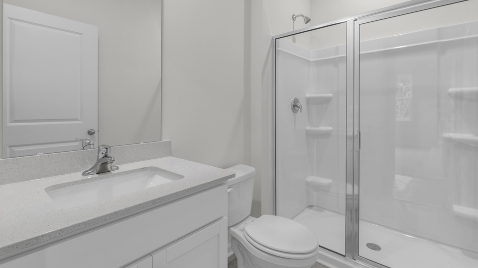 bathroom with white cabinets