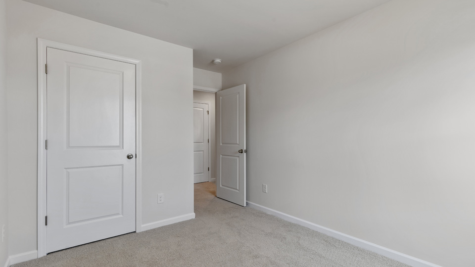 bedroom with natural lighting and carpet flooring