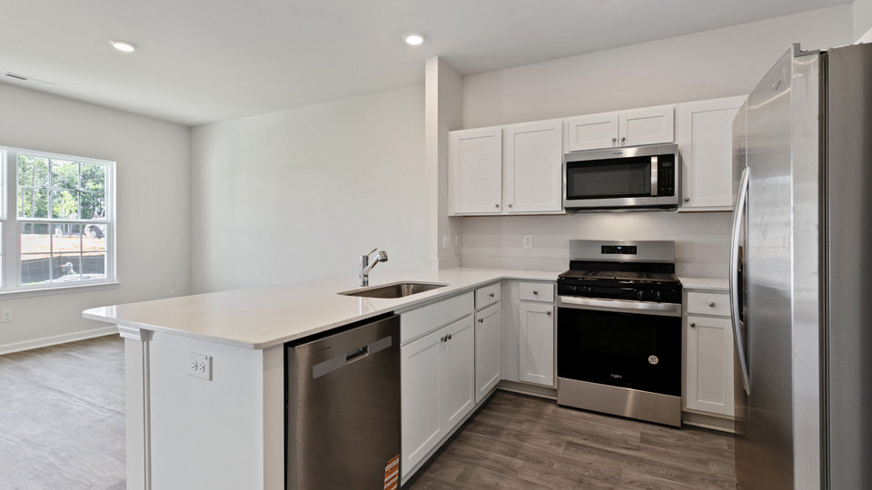 kitchen with stainless steel appliances and quartz countertops
