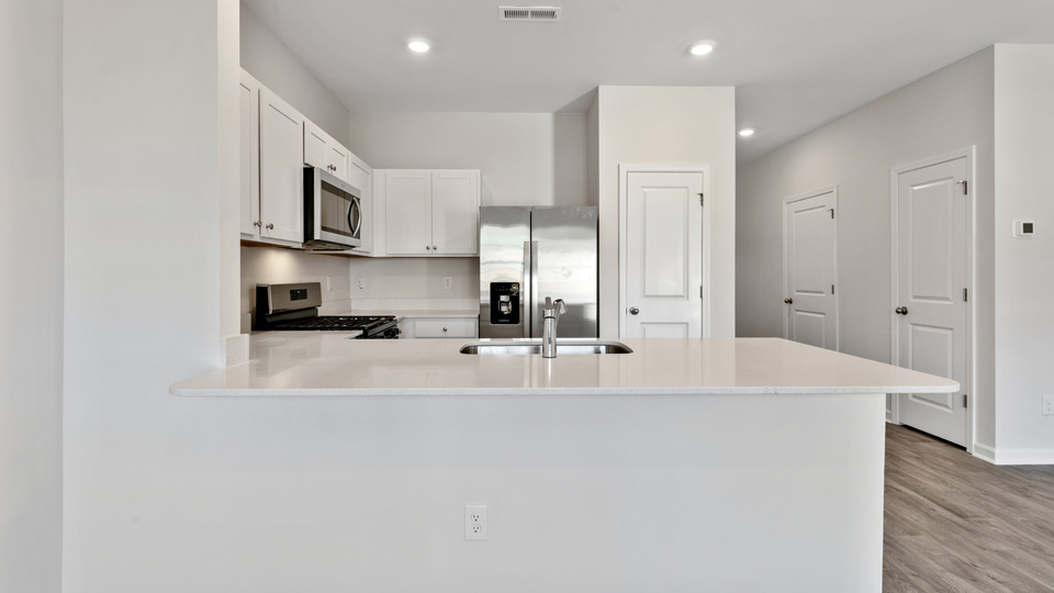 kitchen with stainless steel appliances and quartz countertops