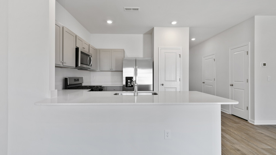 kitchen with stainless steel appliances and quartz countertops