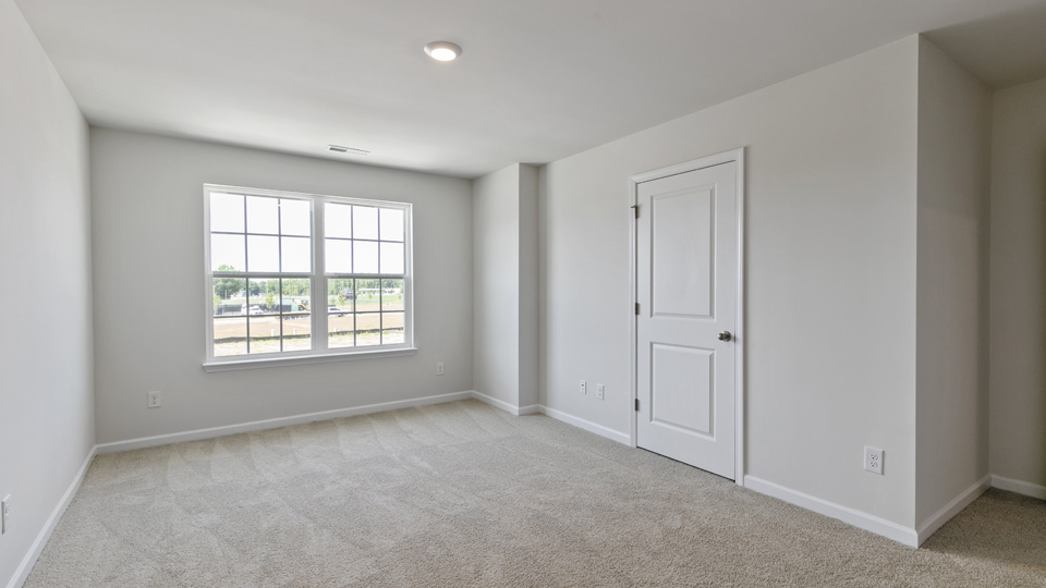 Bedroom with carpet flooring