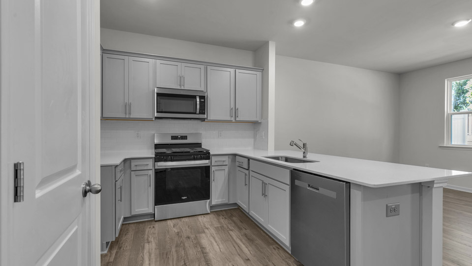 kitchen with quartz countertops and stainless steel appliances