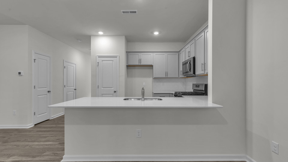 breakfast bar with quartz countertops