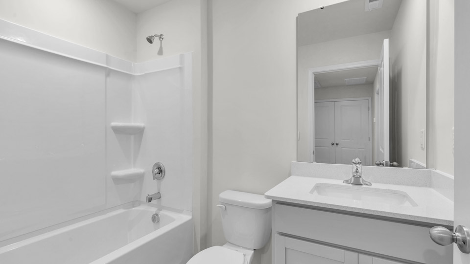 bathroom with quartz countertops