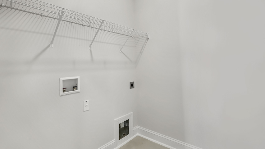 Laundry room with vinyl flooring