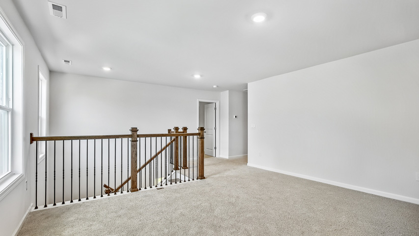 Loft area with carpet