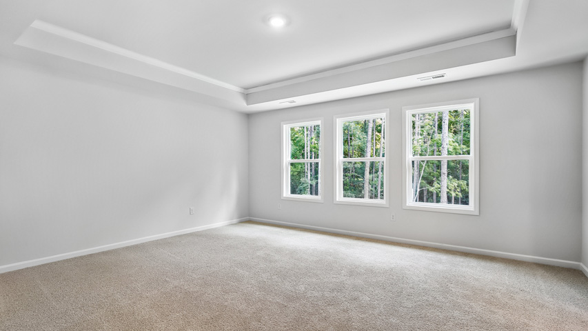 Primary bedroom with carpet