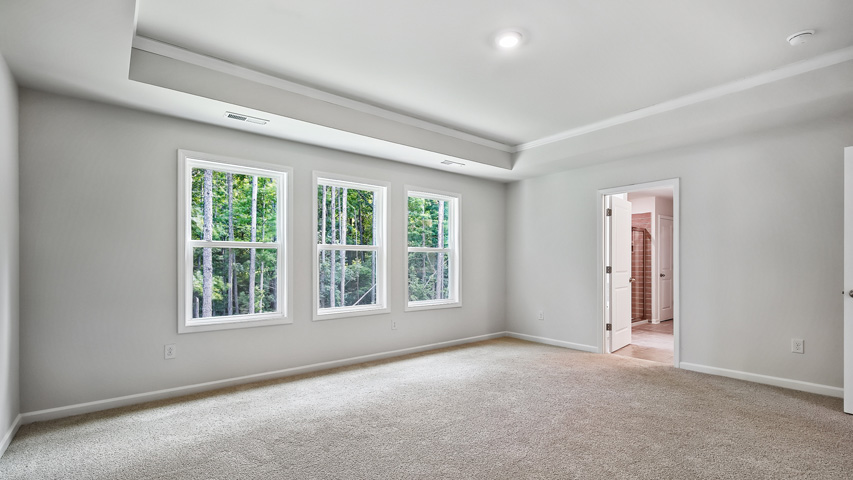 Primary bedroom with carpet