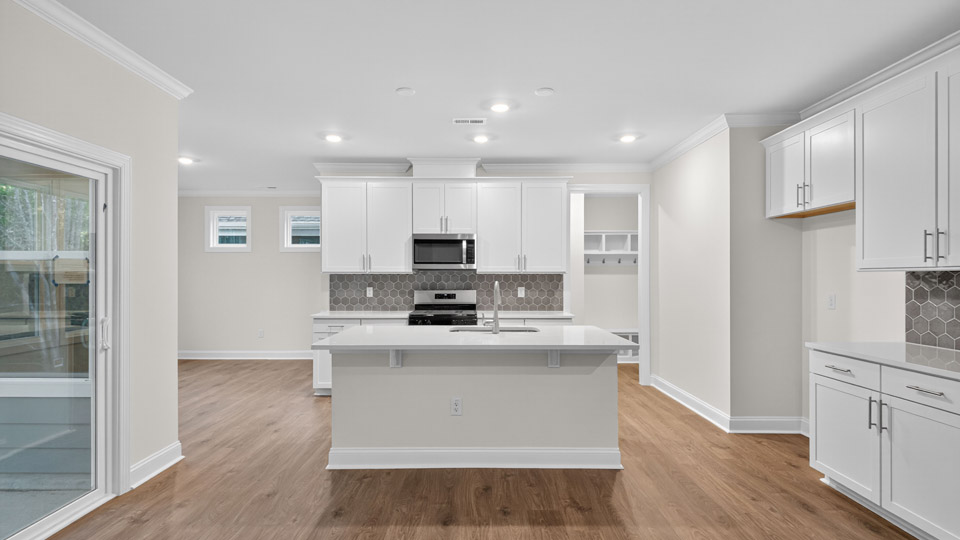 kitchen with white cabinets quartz countertops and stainless steel appliances