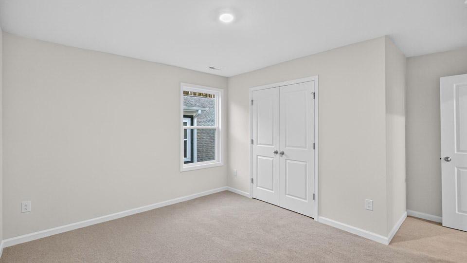 loft with carpet flooring