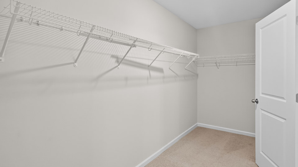 walk-in closet with revwood flooring