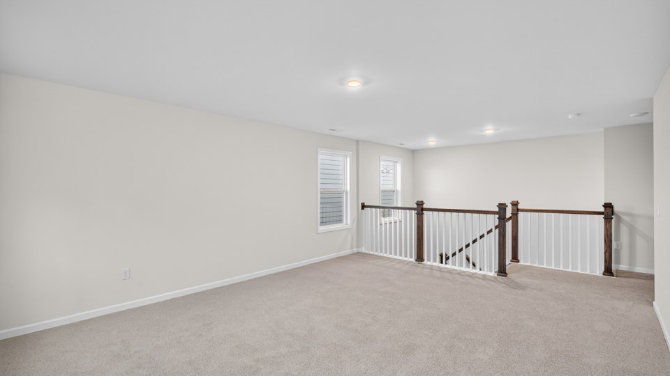 loft with carpet flooring