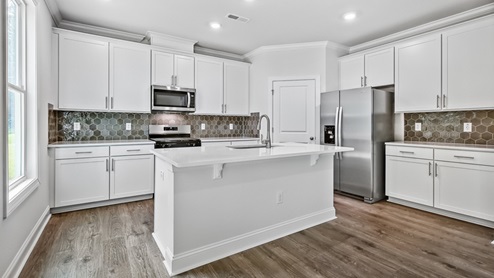 Edisto Kitchen with quartz countertops and stainless steel appliances