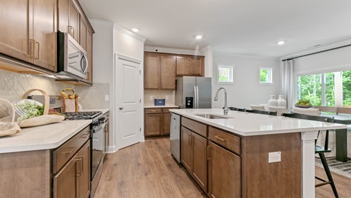 brown kitchen cabinets with quartz countertops