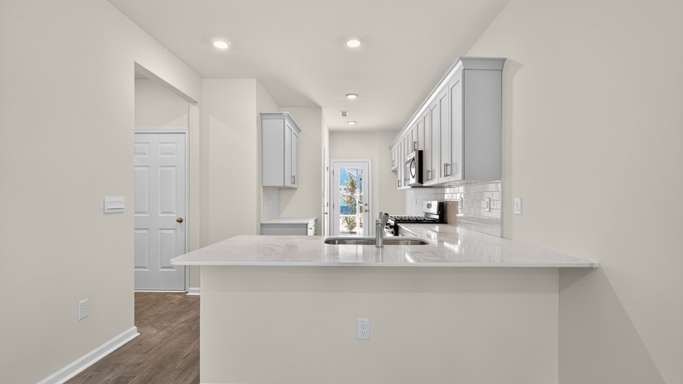 kitchen with quartz countertops and stainless steel appliances