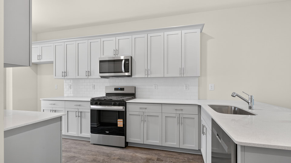 kitchen with quartz countertops and stainless steel appliances