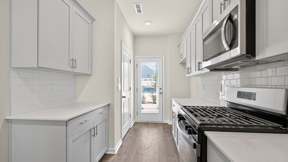 kitchen with quartz countertops and stainless steel appliances