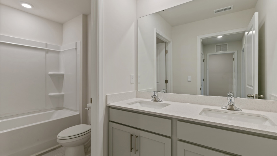 Bathroom with grey cabinets