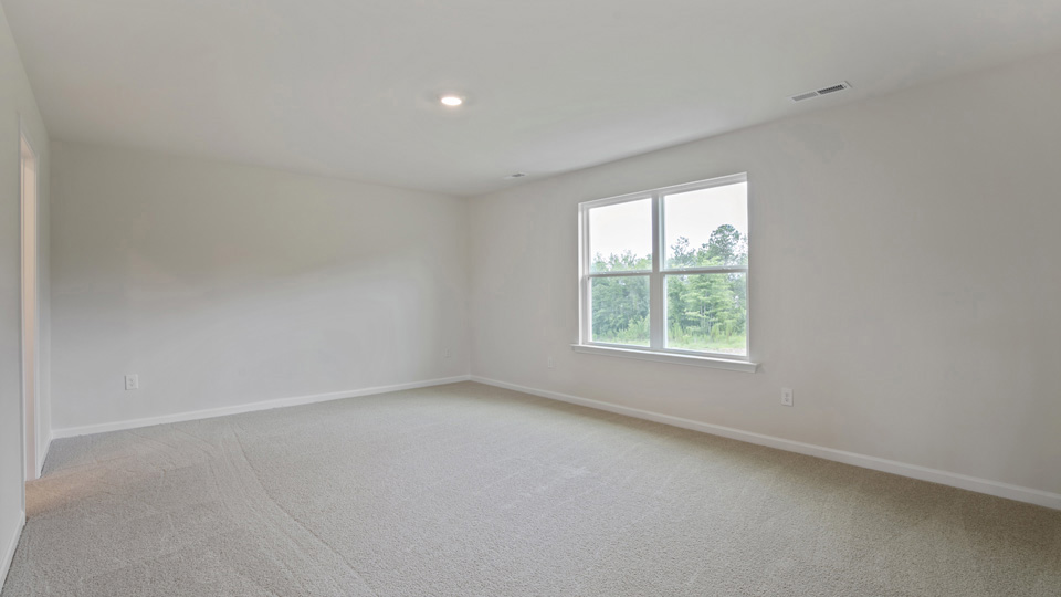Bedroom with carpet flooring