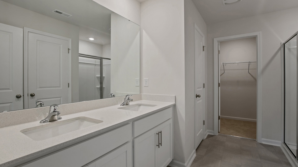 Bathroom with white cabinets