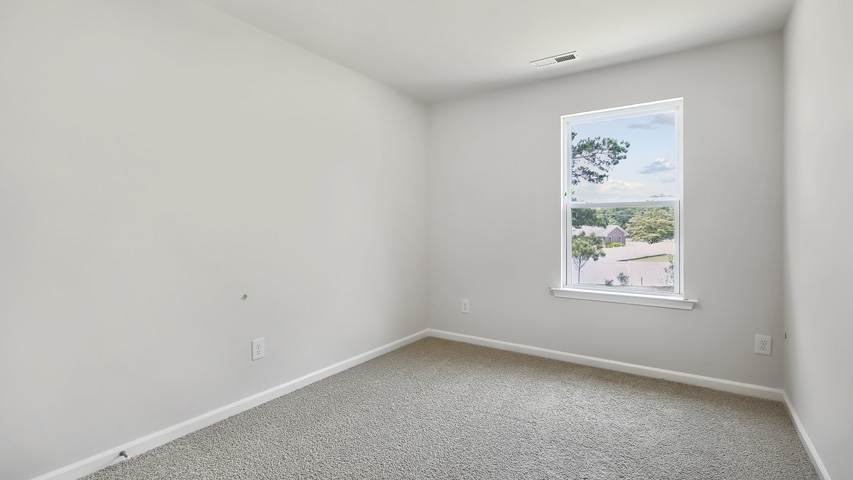 Bedroom with carpet flooring