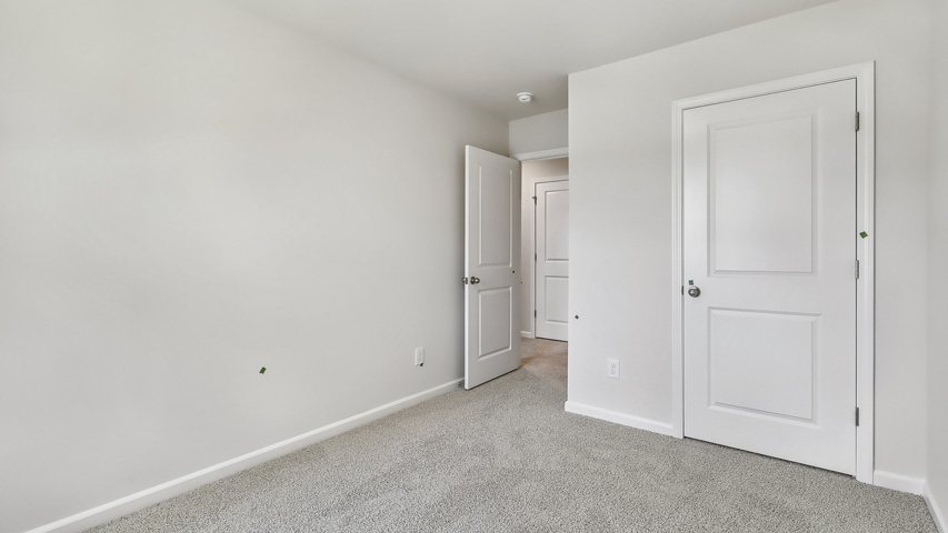 Bedroom with carpet flooring