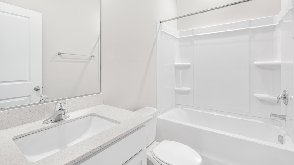 Bathroom with white cabinets