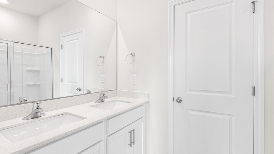 Bathroom with white cabinets