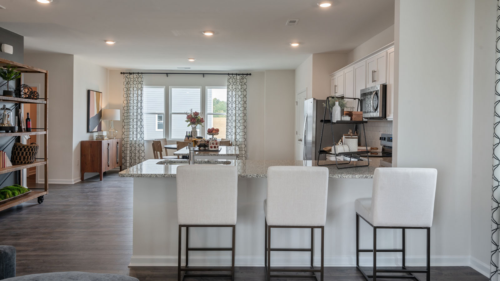 Kitchen with stainless steel appliances and quartz countertops