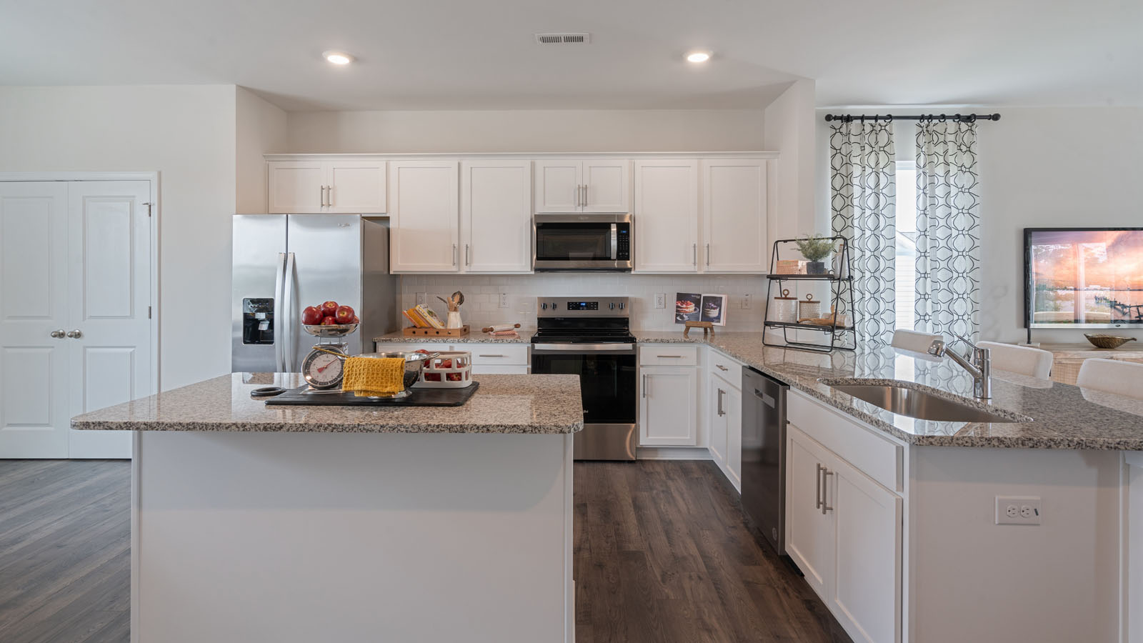 Kitchen with stainless steel appliances and quartz countertops