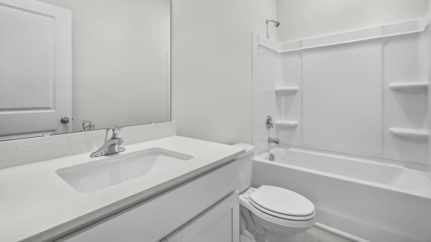 Bathroom with white cabinets