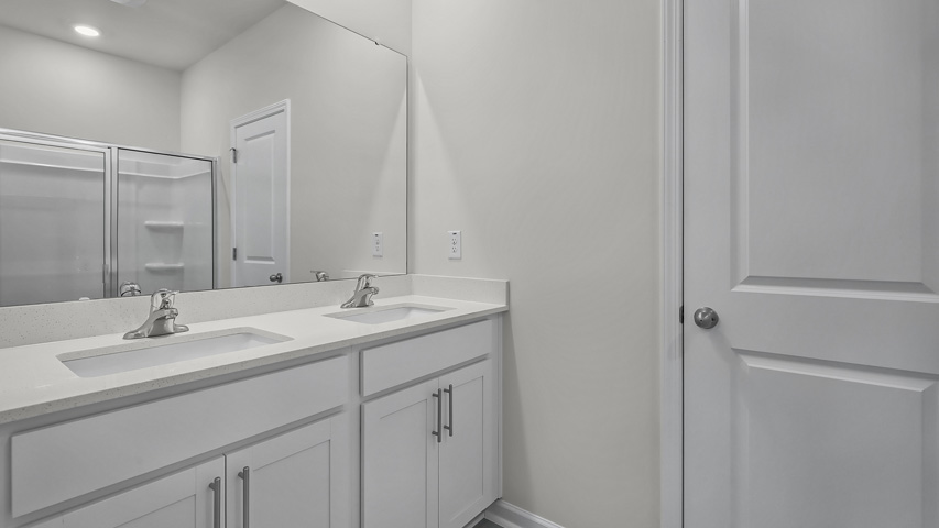 Bathroom with white cabinets