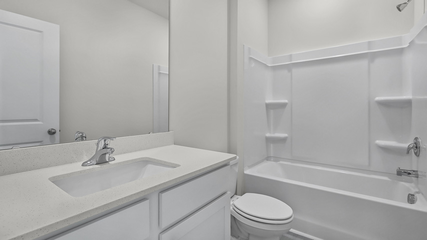 Bathroom with white cabinets
