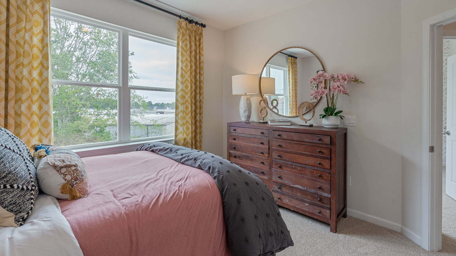 Bedroom with natural lighting and carpet flooring