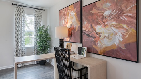 office space with ample lighting and revwood flooring