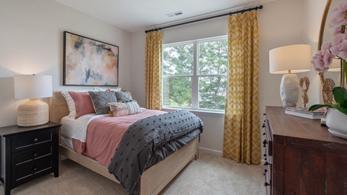 Bedroom with natural lighting and carpet flooring