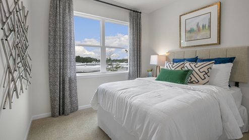Bedroom with natural lighting and carpet flooring