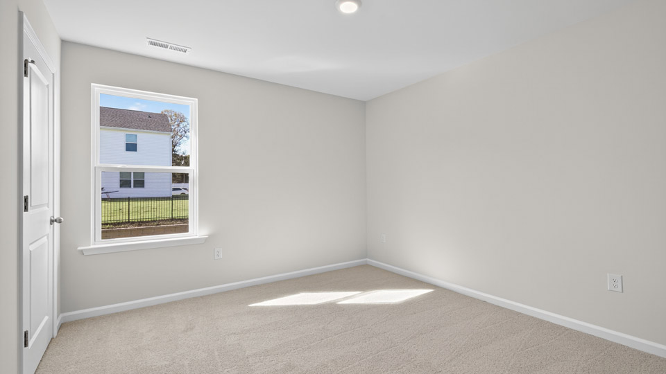 loft with carpet flooring