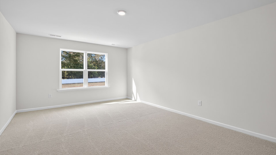 loft with carpet flooring