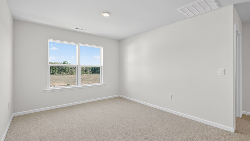 loft with carpet flooring
