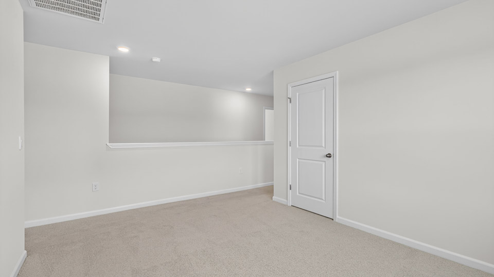 loft with carpet flooring