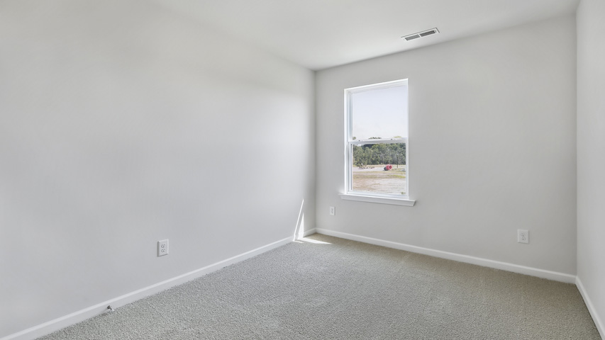 Bedroom with carpet flooring