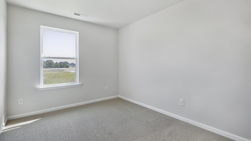 Bedroom with carpet flooring