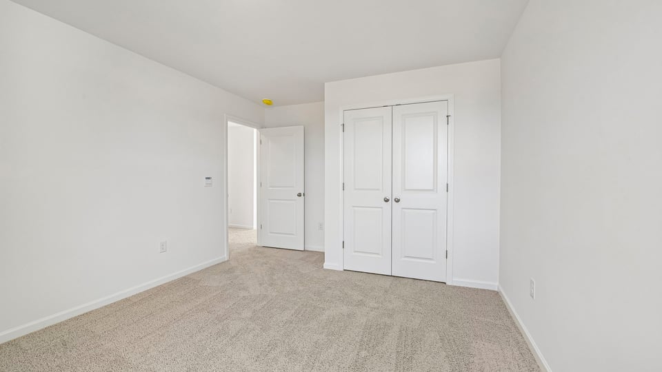 secondary bedroom with carpet flooring