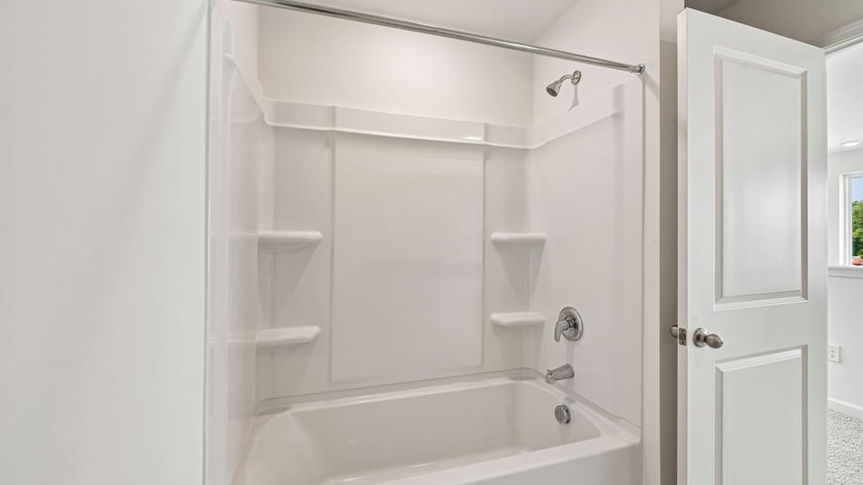 bathroom with tub shower combo