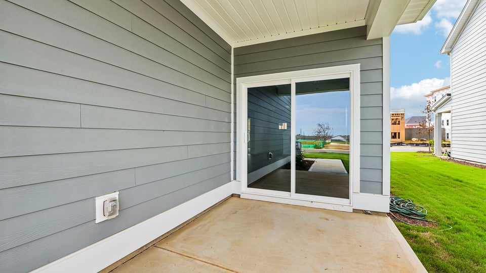 covered patio with sliding glass doors