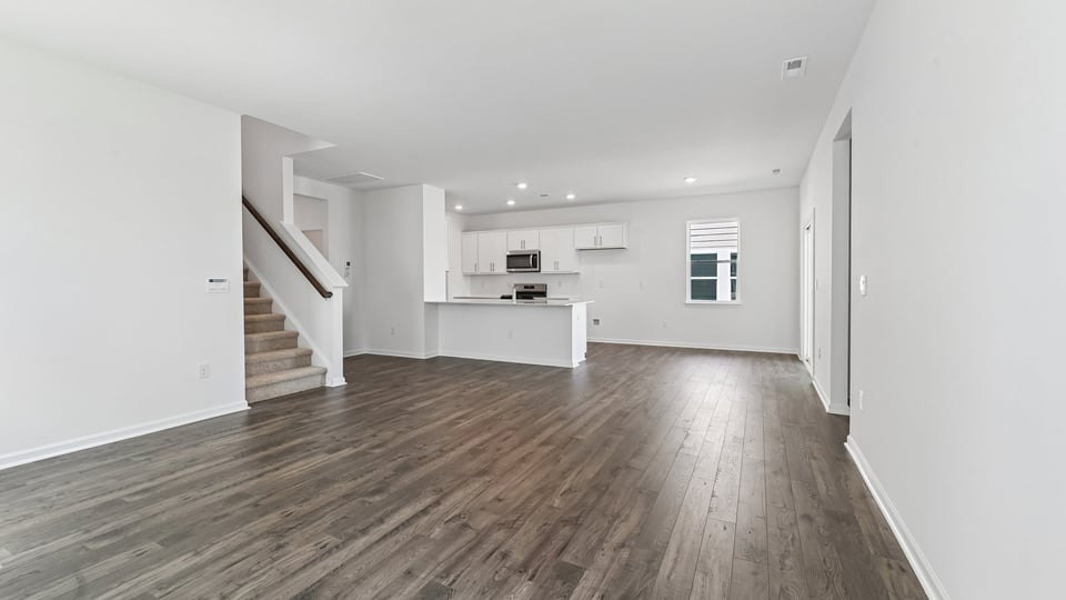 open concept living space with large windows